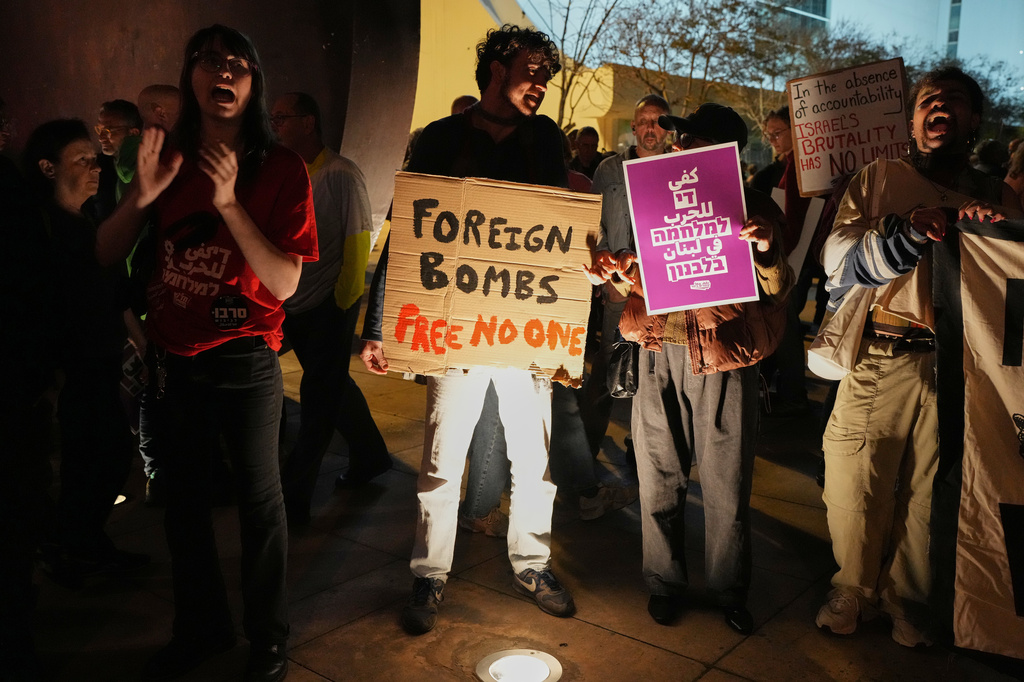 People take part in a protest calling for the end of the war, in Tel Aviv, Israel, Saturday, April 11, 2026. (AP Photo/Maya Levin)