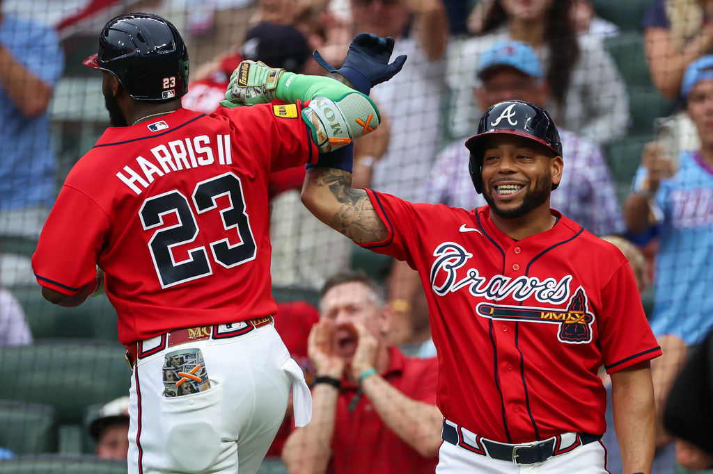 Atlanta Braves' Michael Harris II (23) reacts with Dominic Smith, right, after hitting a two-run home run in the second inning of a baseball game against the New York Mets, Friday, July 3, 2026, in Atlanta. (AP Photo/Colin Hubbard)