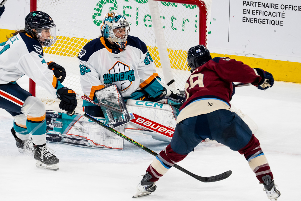 Montréal Victoire's Marie-Philip Poulin (29) scores on New York Sirens goaltender Kayle Osborne (82) during second period PWHL hockey action in Tuesday, Nov. 25, 2025. (Christopher Katsarov/The Canadian Press via AP)