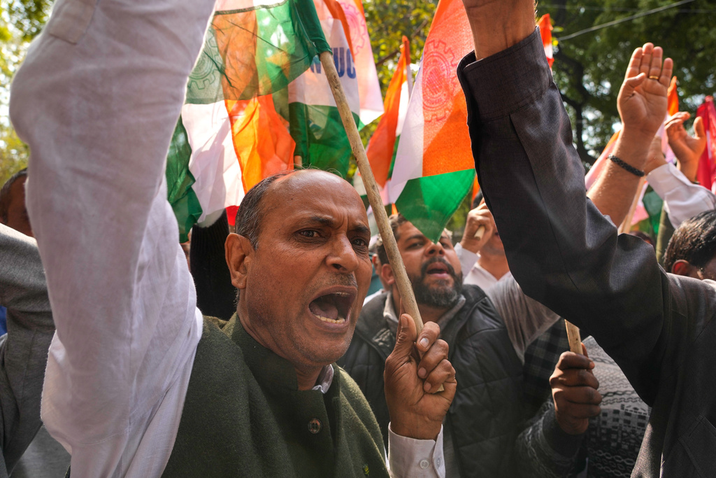 Members of trade unions shout slogans during a nationwide strike to protest an interim trade deal with the United States, saying the agreement undermines the interests of farmers, small businesses and workers in New Delhi, India, Thursday, Feb. 12, 2026. (AP Photo/Manish Swarup)