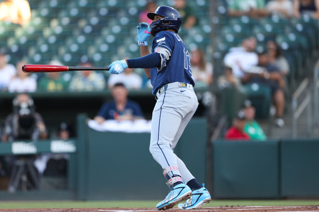 Tampa Bay Rays' Junior Caminero watches his two-run home run during the first inning of a baseball game against the Athletics Tuesday, Aug. 11, 2026, in West Sacramento, Calif. (AP Photo/Scott Marshall)