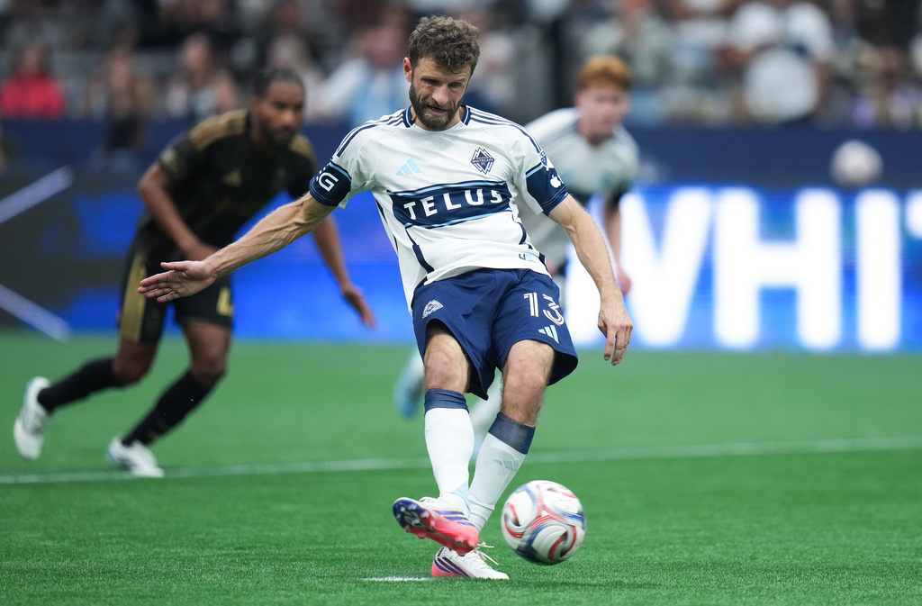 Vancouver Whitecaps' Thomas Muller scores on a penalty kick during the second half of an MLS soccer match against Los Angeles FC, in Vancouver, on Saturday, August 1, 2026. (Darryl Dyck/The Canadian Press via AP)