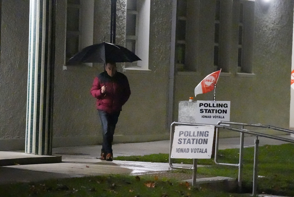 Early voters arrive at Scoil Mhichil Naofa (St Michael's National School) in Athy, Co Kildare, as voting beings in Ireland's presidential election, Friday, Oct.24, 2025. ( Niall Carson/PA via AP)