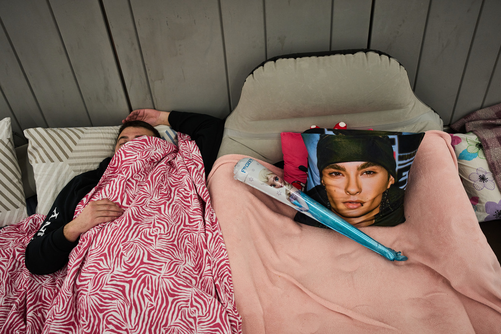 A man takes shelter in an underground metro station as a precaution against possible Iranian missile attacks, in Ramat Gan, Israel Monday, March 2, 2026. (AP Photo/Oded Balilty)
