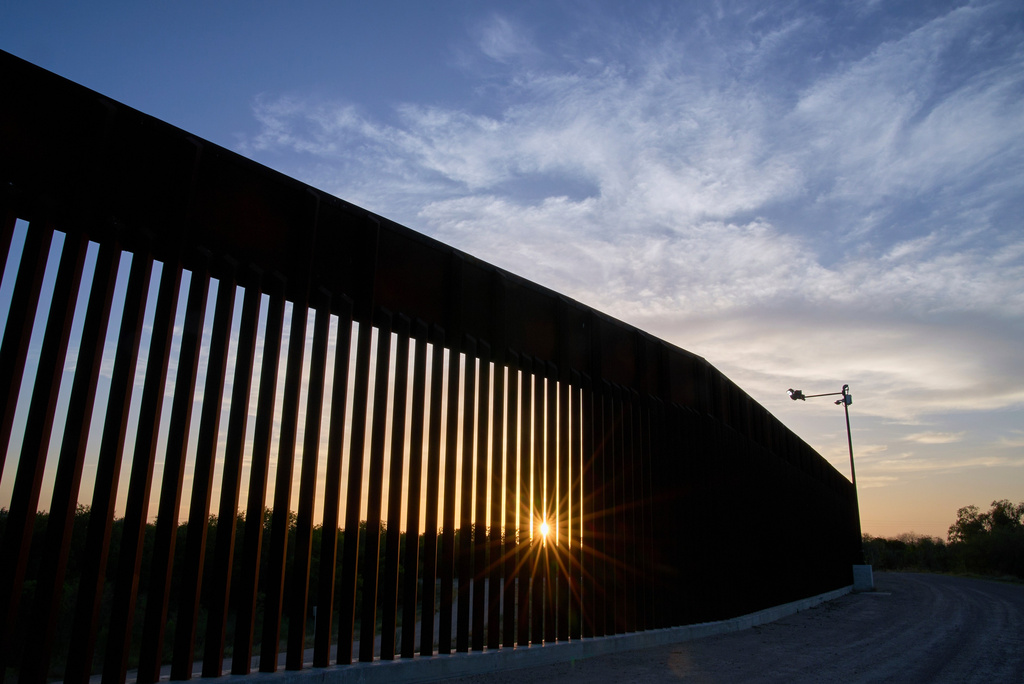 FILE - The sun sets over a section of the border wall, June 18, 2025, in Mission, Texas. (AP Photo/Jacquelyn Martin, File)