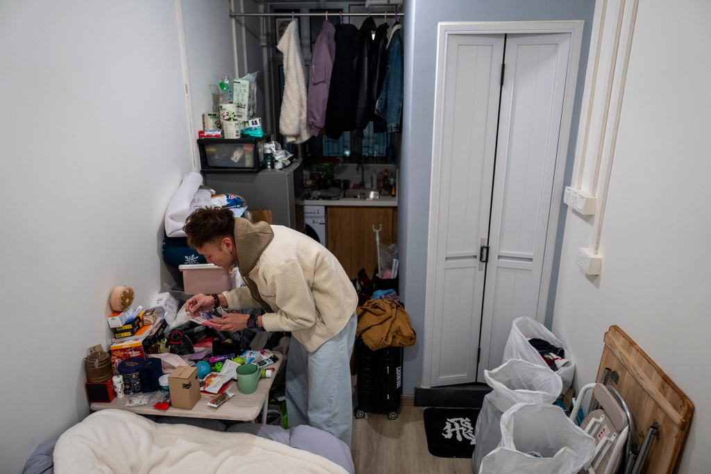Dorz Cheung, a resident displaced by the deadly Wang Fuk Court fire, is seen at the transitional housing provided by the government in Hong Kong, Monday, Feb. 2, 2026. (AP Photo/Chan Long Hei)