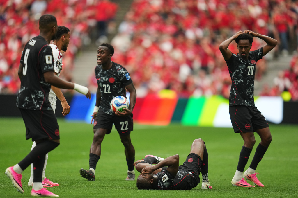 Canada's Ismael Kone, below, lays on the ground after sustaining an injury during the World Cup Group B soccer match against Qatar in Vancouver, British Columbia, Thursday, June 18, 2026. (AP Photo/Abbie Parr)