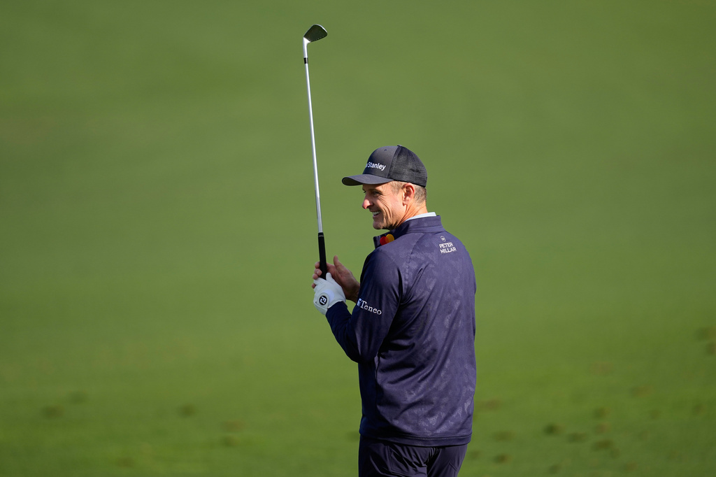 Justin Rose, of England, warms up on the driving range before a practice round at of the Masters golf tournament at the Augusta National Golf Club, Monday, April 6, 2026, in Augusta, Ga. (AP Photo/David J. Phillip)