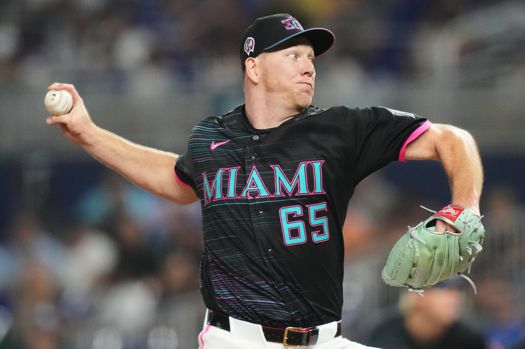 Miami Marlins starting pitcher Ryan Gusto throws during the fourth inning of a baseball game against the Los Angeles Dodgers, Friday, Sept. 11, 2026, in Miami. (AP Photo/Lynne Sladky)