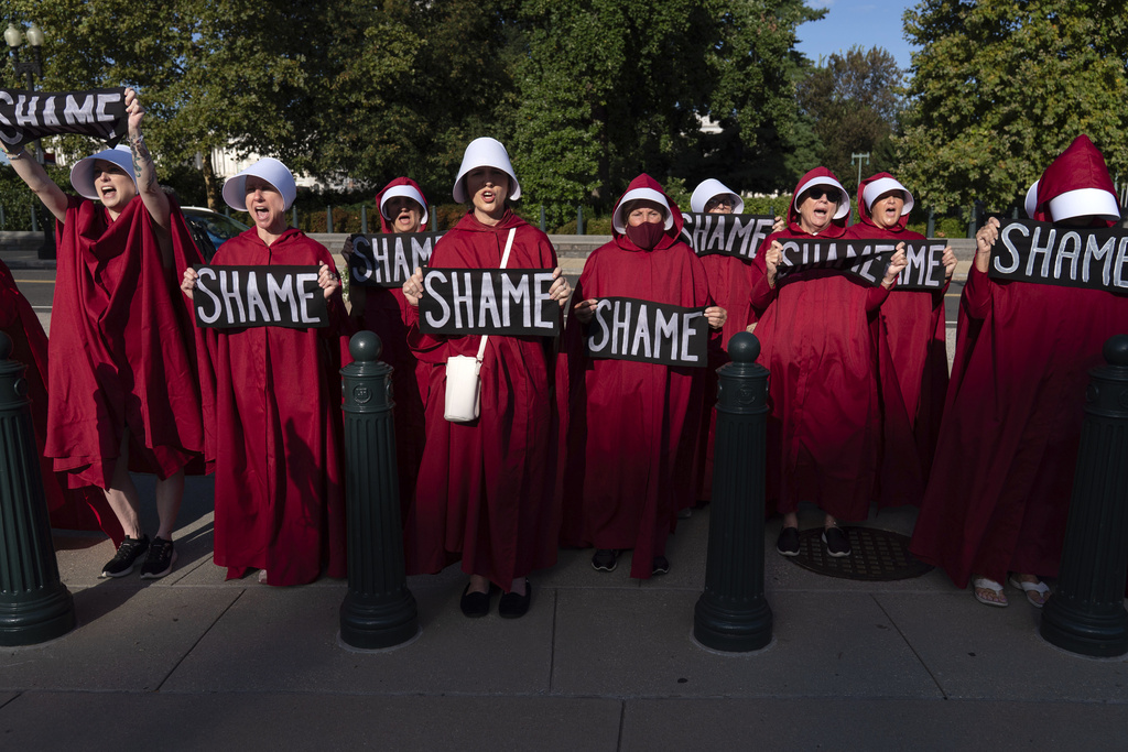 Abortion rights activists protest against President Donald Trump's use of federal law enforcement and National Guard troops in Washington during protest at the U.S. Capitol, Tuesday, Sept. 2, 2025. (AP Photo/Jose Luis Magana)