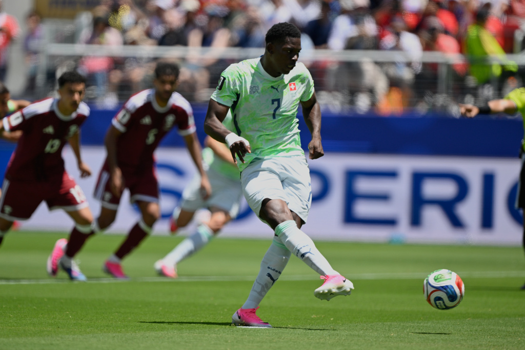 Switzerland's Breel Embolo shoot and scores the opening goal from the penalty spot during the World Cup Group B soccer match between Qatar and Switzerland in Santa Clara, Calif., near San Francisco, Saturday, June 13, 2026. (AP Photo/Eakin Howard)