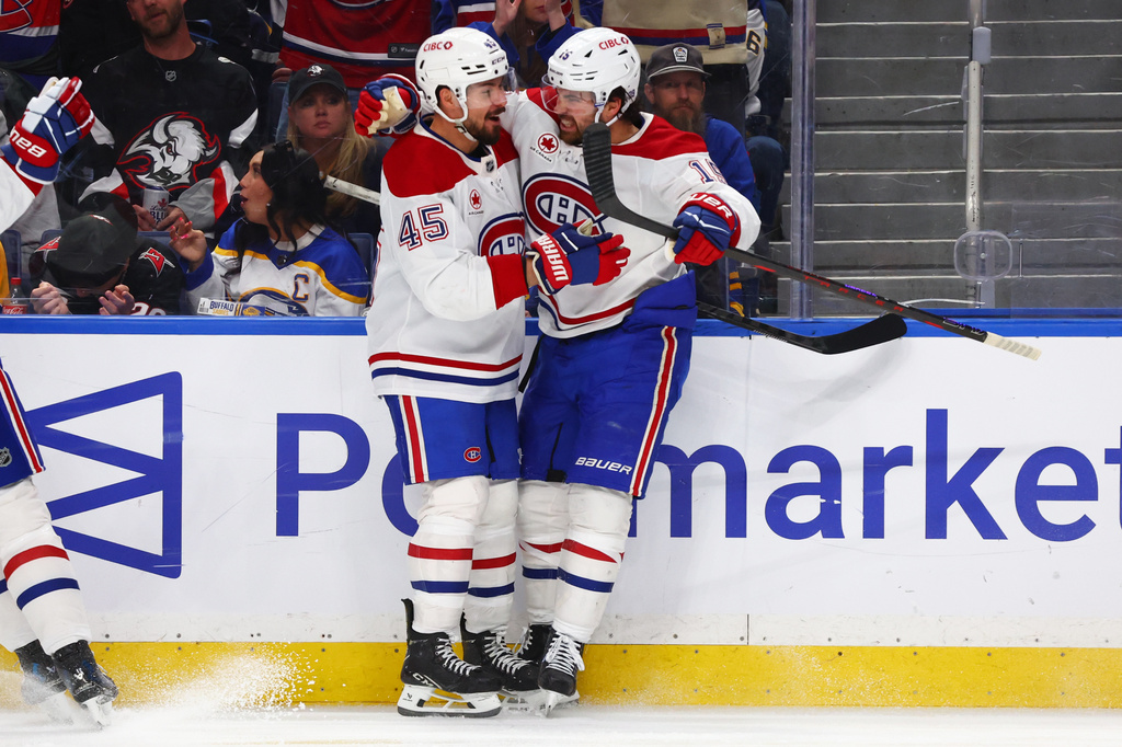 Montreal Canadiens center Alex Newhook (15) celebrates his goal with defenseman Alexandre Carrier (45) during the second period in Game 2 of a second-round NHL hockey Stanley Cup playoff series against the Buffalo Sabres Friday, May 8, 2026, in Buffalo, N.Y. (AP Photo/Jeffrey T. Barnes)