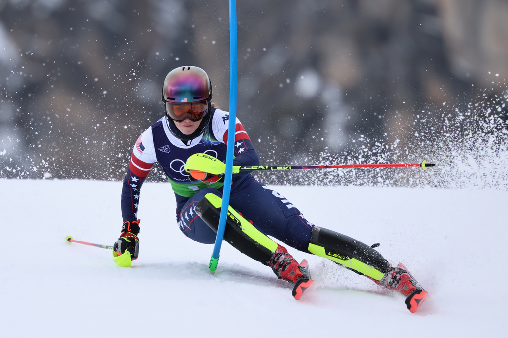 United States' Mikaela Shiffrin speeds down the course during an alpine ski, slalom portion of a women's team combined race, at the 2026 Winter Olympics, in Cortina d'Ampezzo, Italy, Tuesday, Feb. 10, 2026. (AP Photo/Marco Trovati)