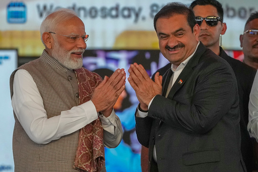 Indian Prime Minister Narendra Modi, left, greets Chairman Adani Group, Gautam Adani during the inauguration ceremony of the Navi Mumbai International Airport in Navi Mumbai, India, Wednesday, Oct. 8, 2025. (AP Photo/Rafiq Maqbool) Indian Prime Minister Narendra Modi, left, greets Chairman Adani Group, Gautam Adani during the inauguration ceremony of the Navi Mumbai International Airport in Navi Mumbai, India, Wednesday, Oct. 8, 2025. (AP Photo/Rafiq Maqbool)
