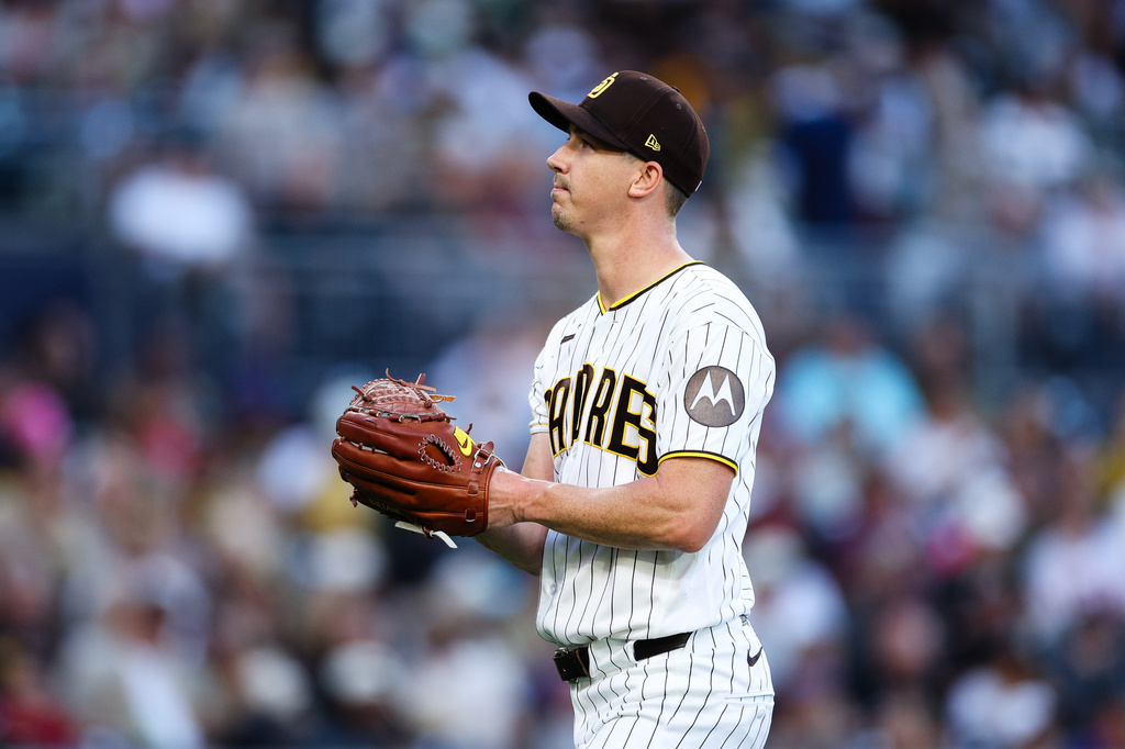 San Diego Padres pitcher Walker Buehler walks off the mound in the second inning of a baseball game against the Arizona Diamondbacks, Monday, July 6, 2026, in San Diego. (AP Photo/Derrick Tuskan)