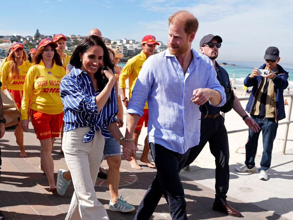 FILE - Prince Harry, and Meghan, the Duke and Duchess of Sussex, walk along the boardwalk after meeting volunteer first responders from Bondi Surf Bathers' Life Saving Club, during a visit to Bondi Beach, Australia, Friday, April 17, 2026. (Jonathan Brady/Pool Photo via AP,File)