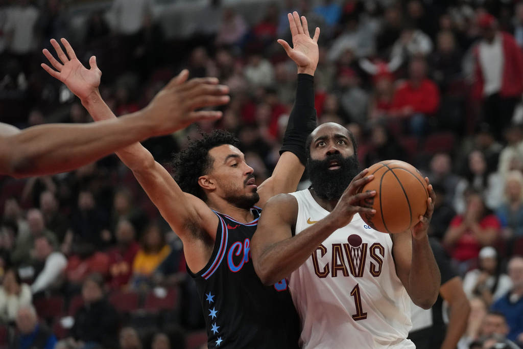 Cleveland Cavaliers guard James Harden (1), right, handles the ball as Chicago Bulls guard Tre Jones (30) defends during the second half of an NBA basketball game Thursday, March 19, 2026, in Chicago. (AP Photo/Erin Hooley)
