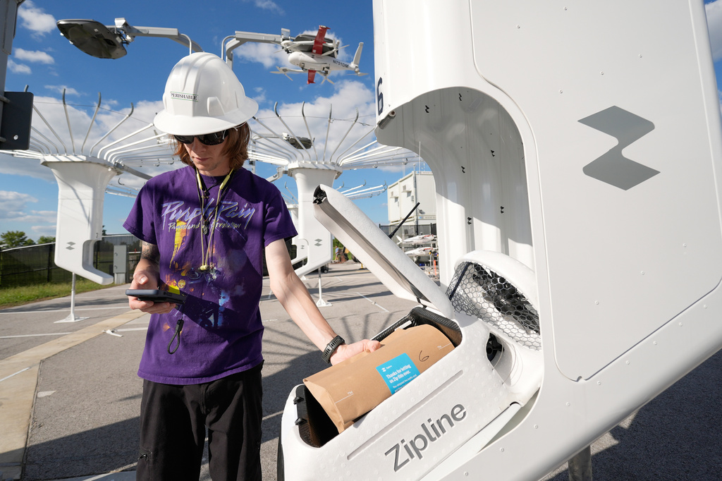 A Zipline employee loads a drone with an order at a Walmart store in Pea Ridge, Ark., Friday, Sept. 26, 2025. (AP Photo/Charlie Riedel)
