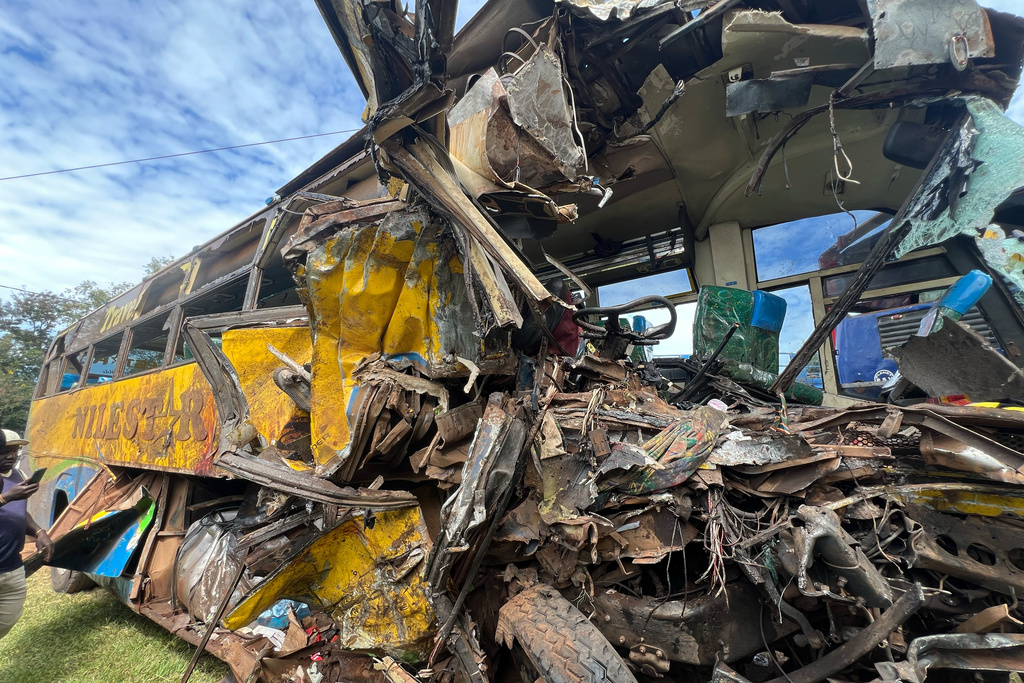 Wreckage of a bus involved in a collision that left several people dead near Kiryandongo on the highway from the Ugandan capital of Kampala to the city of Gulu in northern Uganda, Wednesday, Oct. 22, 2025. (AP Photo/ Hakiim Wampamba)
