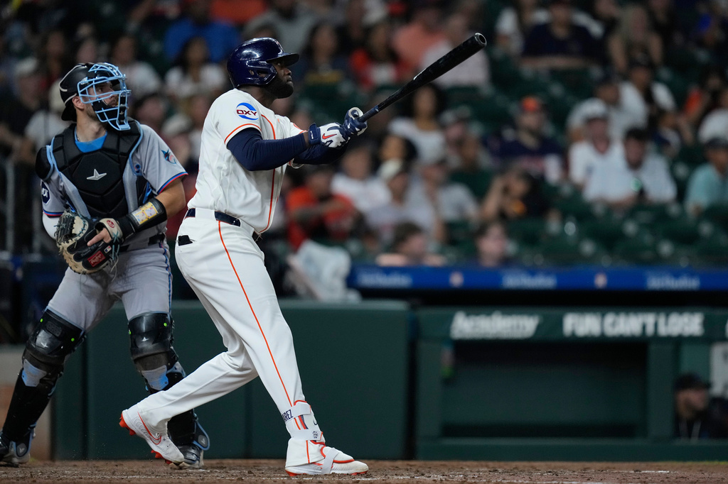 Houston Astros' Yordan Alvarez hits a two-run home run during the eighth inning of a baseball game against the Miami Marlins, Wednesday, July 22, 2026, in Houston. (AP Photo/Kevin M. Cox)