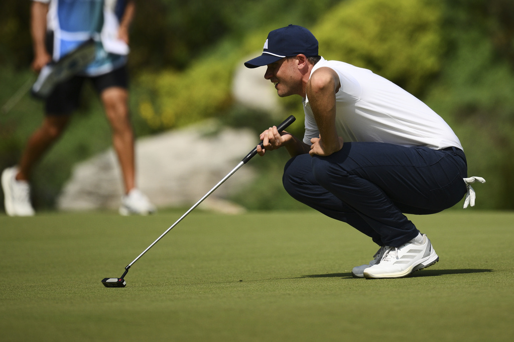Ludvig Åberg, of Sweden, lines up a putt on the 18th hole during the second round of the BMW Championship golf tournament Friday, Aug. 15, 2025, in Owings Mills, Md. (AP Photo/Nick Wass)