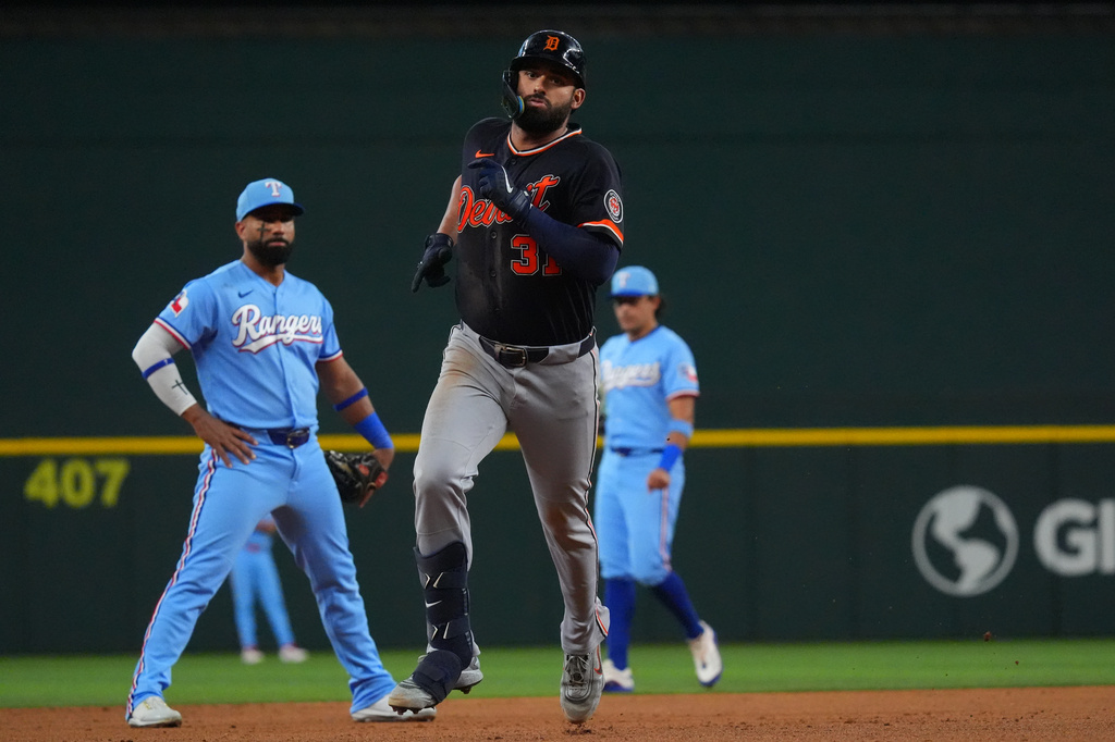 Detroit Tigers' Riley Greene, front right, runs the bases after hitting a home run during the fourth inning of a baseball game against the Texas Rangers, Sunday, July 5, 2026, in Arlington, Texas. (AP Photo/LM Otero)