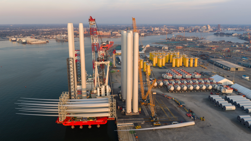 FILE - A construction barge is loaded at the Dominion Energy Offshore Wind Farm staging area at the Portsmouth Marine terminal Feb. 11, 2026, in Portsmouth, Va. (AP Photo/Steve Helber, File)