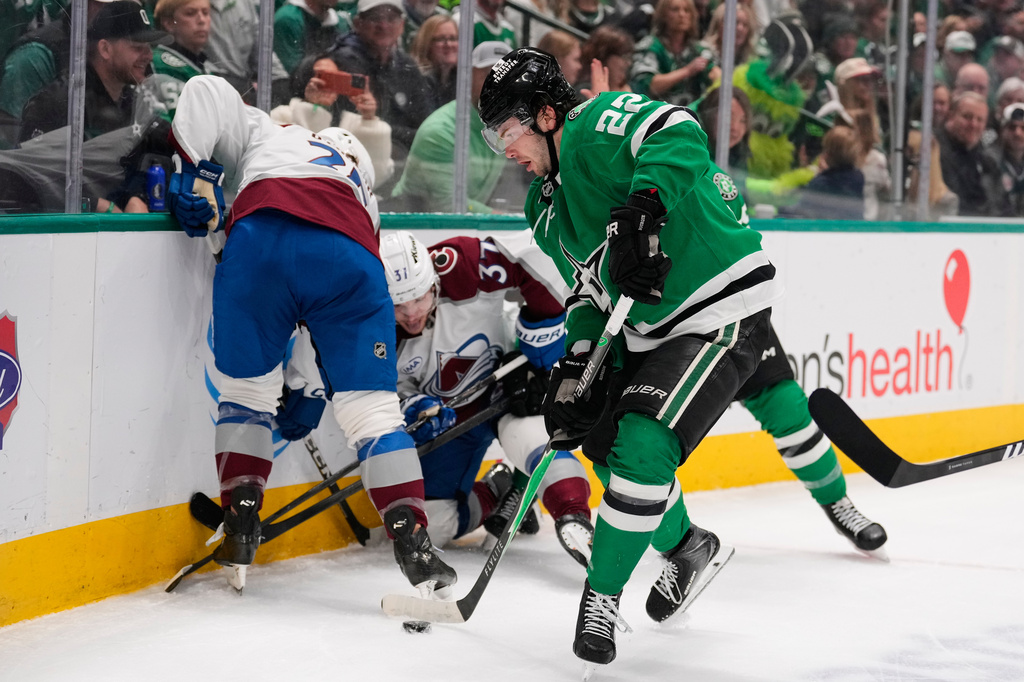 Dallas Stars center Mavrik Bourque (22) takes control of the puck in the first period of an NHL hockey game against the Colorado Avalanche Saturday, April 4, 2026, in Dallas. (AP Photo/Tony Gutierrez)
