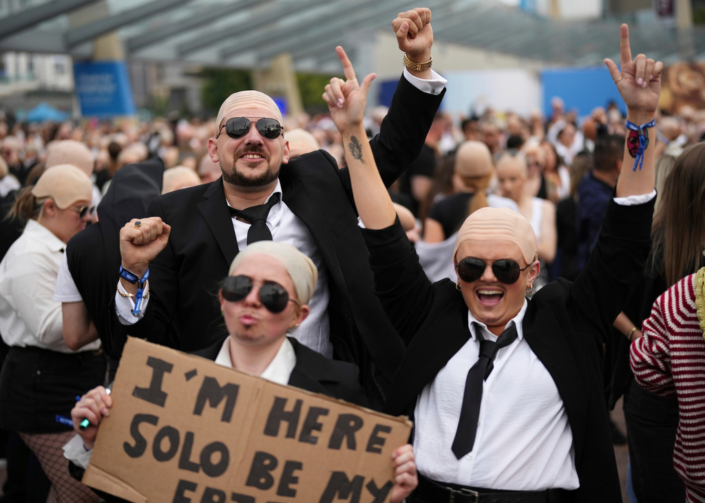 FILE - Fans gather in front of the O2 Arena prior to a performance by Pitbull on Monday, June 9, 2025, in London. (Photo by Scott A Garfitt/Invision/AP, File)