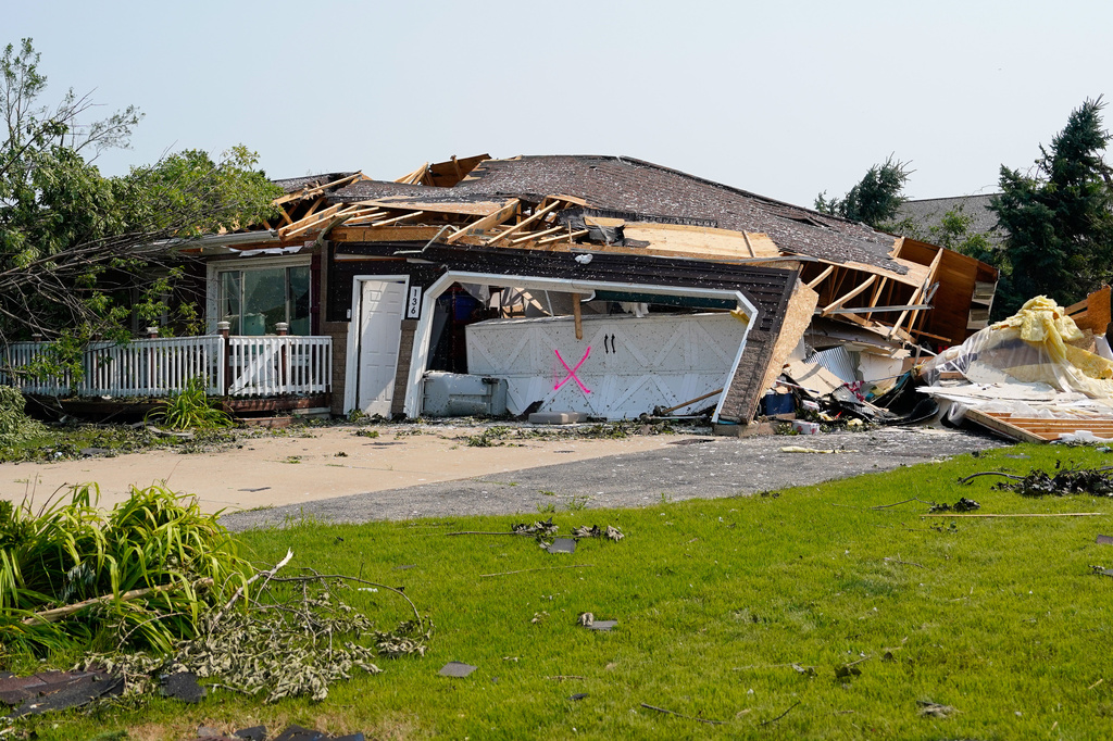 A view of a home damaged by a tornado that tore through a day before in Appleton, Wis., Tuesday, July 28, 2026. (AP Photo/Kayla Wolf)