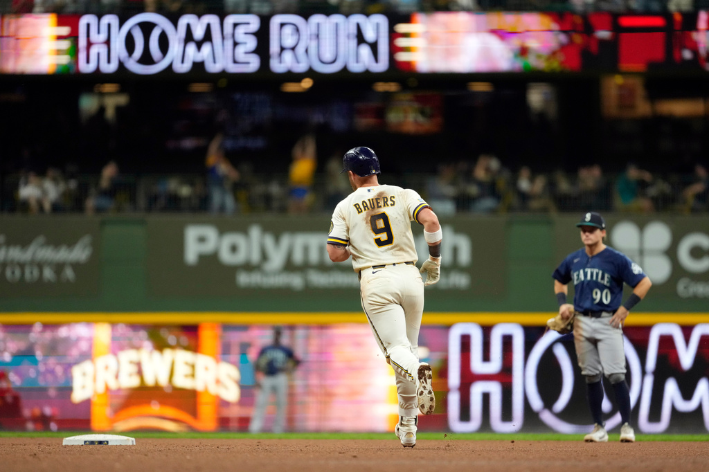 Milwaukee Brewers' Jake Bauers rounds the bases after hitting a two-run home run during the sixth inning of a baseball game against the Seattle Mariners, Tuesday, Aug. 18, 2026, in Milwaukee. (AP Photo/Aaron Gash)
