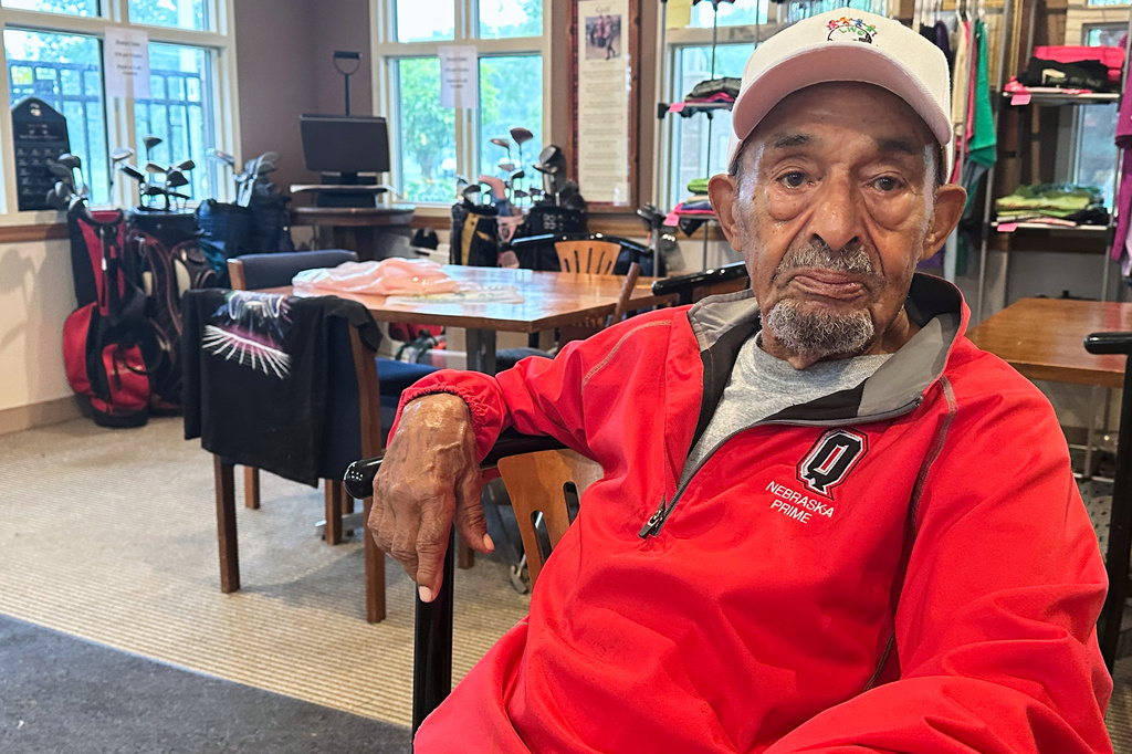 Bob Walls, a 103-year-old golfer, sits for an interview in the clubhouse at Steve Hogan Golf Course in Omaha, Neb., Friday, July 24, 2026. (AP Photo/Eric Olson)