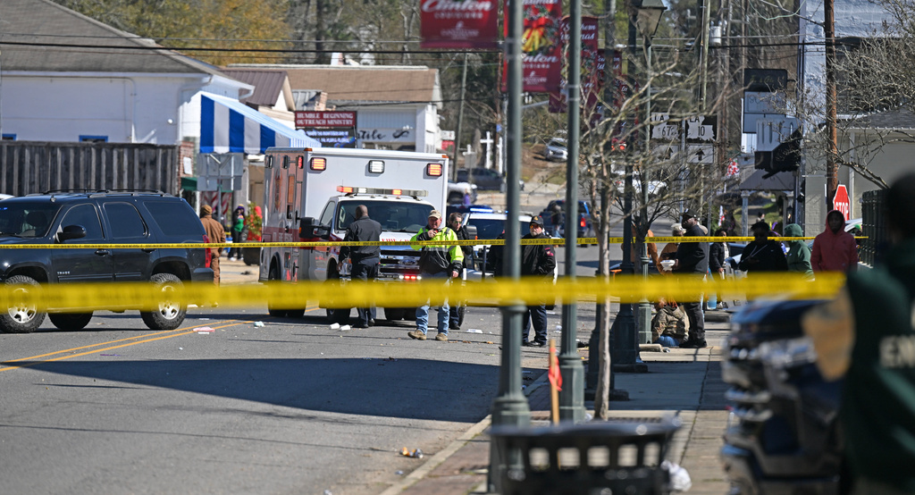 Law enforcement and emergency crews work at the scene of a shooting at the Clinton Mardi Gras Parade in Baton Rouge, La., on Saturday, Jan. 31, 2026. (Hilary Scheinuk/The Advocate via AP)