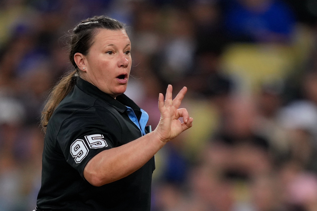 Home plate umpire Jen Pawol asks for more baseballs during the third inning of a baseball game between the Los Angeles Dodgers and the Los Angeles Angels, Friday, June 5, 2026, in Los Angeles. (AP Photo/Mark J. Terrill)