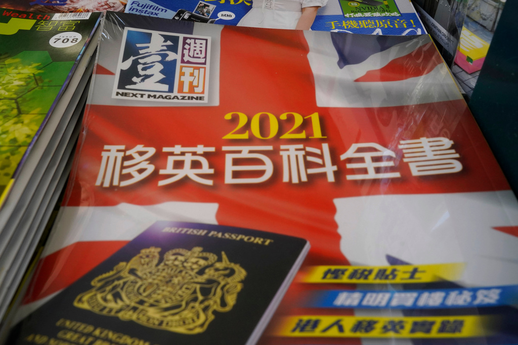 Copies of Next Magazine, owned by Jimmy Lai, are displayed for sale at a newsstand in Hong Kong, Monday, May 17, 2021. (AP Photo/Kin Cheung, File)
