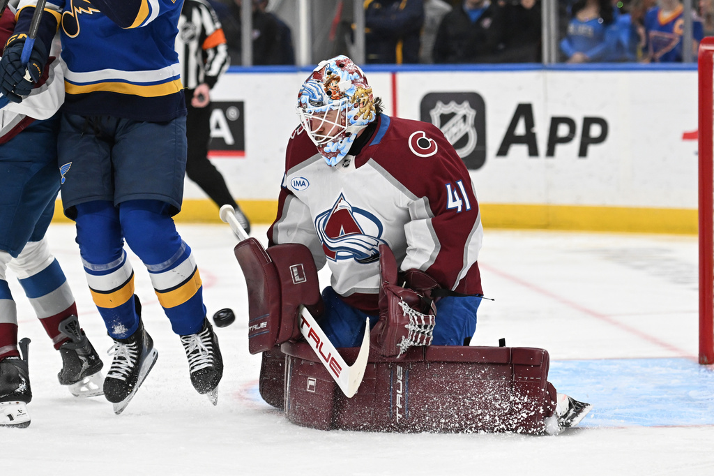 Colorado Avalanche goaltender Scott Wedgewood (41) blocks a shot from the St. Louis Blues during the second period of an NHL hockey game, Tuesday, April 7, 2026, in St. Louis. (AP Photo/Joe Puetz)