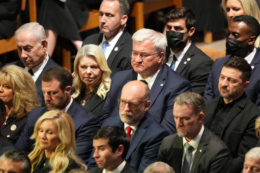 Israel's Prime Minister Benjamin Netanyahu, left, and Ukraine's President Volodymyr Zelenskyy, right, attend the funeral of Sen. Lindsey Graham, R-S.C., at the Washington National Cathedral, Tuesday, July 28, 2026, in Washington. (AP Photo/Alex Brandon)