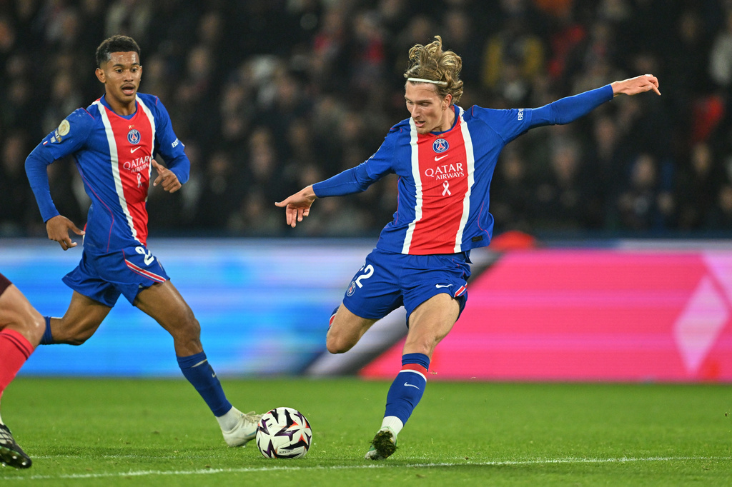 PSG's Mika Godts scores his side's second goal during the French League One soccer match between Paris Saint-Germain and Lyon in Paris, Monday, Oct. 26, 2026. (AP Photo/Emma Da Silva)