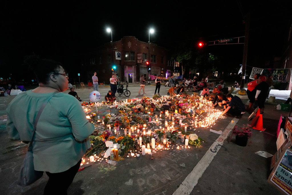 Attendees gather at a memorial Thursday, July 23, 2026, in Madison, Wis., where a Madison police officer shot and killed Corey Durell Ruiz on Wednesday. (AP Photo/Kayla Wolf)