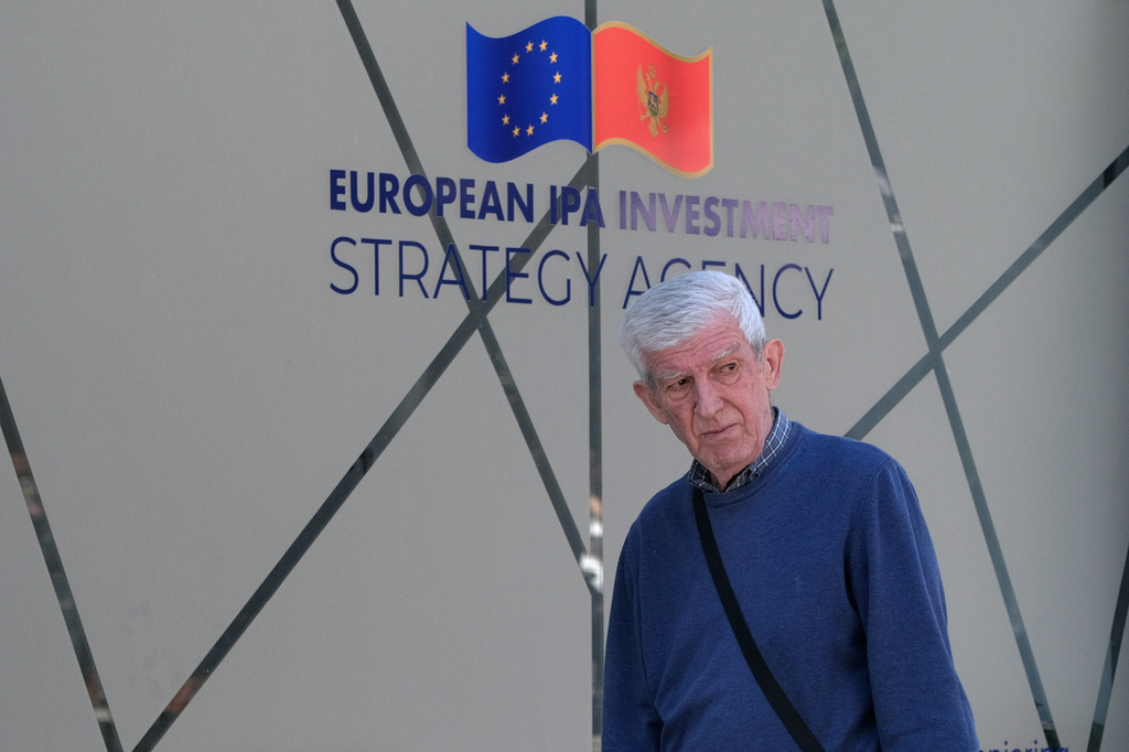 A man walks on a street in Montenegro's capital Podgorica, Monday, May 18, 2026. (AP Photo/Risto Bozovic)