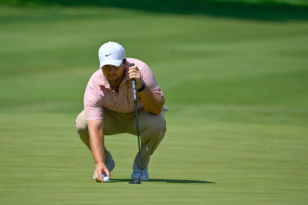 Chris Gotterup lines up a putt on the 18th hole during the final round of the John Deere Classic golf tournament, Sunday, July 5, 2026, in Silvis, Ill. (AP Photo/Matt Marton)