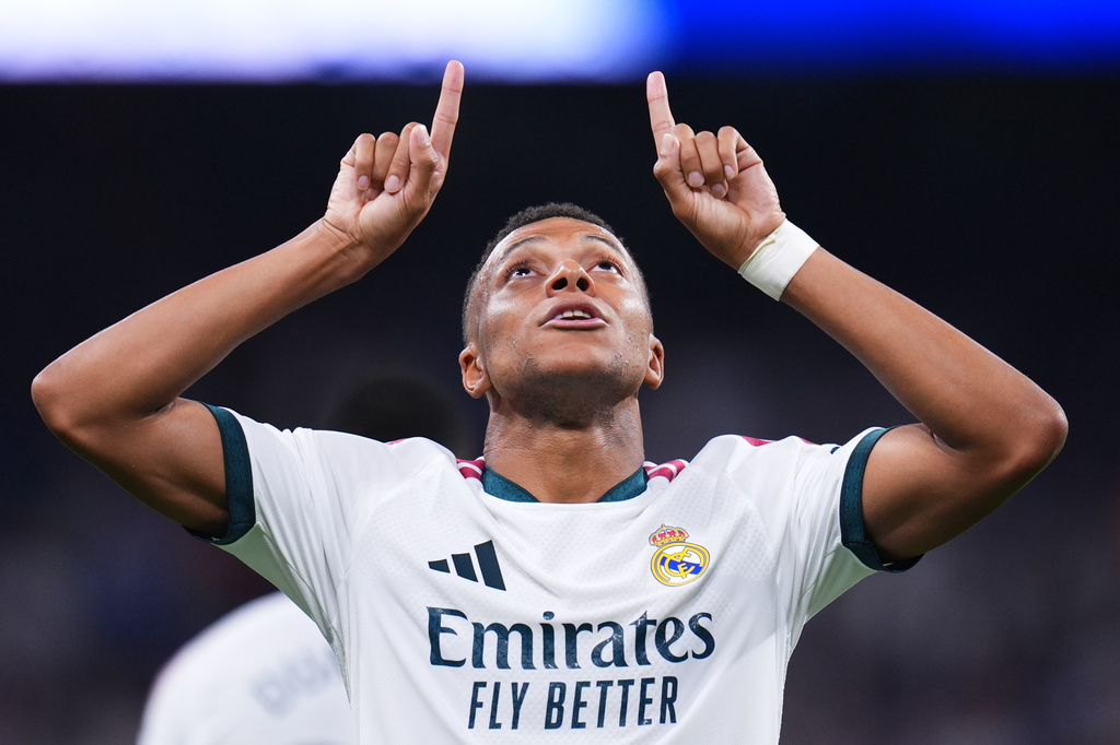 Real Madrid's Kylian Mbappe celebrates scoring his side's 4th goal during the Spanish La Liga soccer match between Real Madrid and Rayo Vallecano in Madrid, Spain, Saturday, Sept. 12, 2026. (AP Photo/Manu Fernandez)