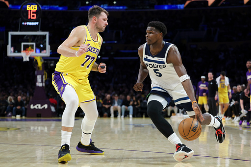 Minnesota Timberwolves guard Anthony Edwards (5) dribbles against Los Angeles Lakers guard Luka Doncic (77) during the second half of an NBA basketball game, Friday, Oct. 24, 2025, in Los Angeles. (AP Photo/Jessie Alcheh) Minnesota Timberwolves guard Anthony Edwards (5) dribbles against Los Angeles Lakers guard Luka Doncic (77) during the second half of an NBA basketball game, Friday, Oct. 24, 2025, in Los Angeles. (AP Photo/Jessie Alcheh)