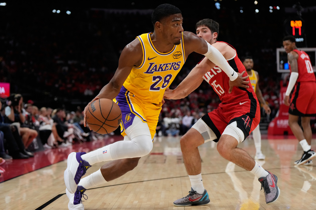 Los Angeles Lakers forward Rui Hachimura (28) controls the ball against Houston Rockets guard Reed Sheppard (15) during the first half of Game 6 of a first-round NBA playoffs basketball series in Houston, Friday, May 1, 2026. (AP Photo/Ashley Landis)