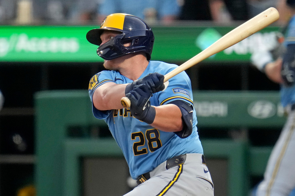 Milwaukee Brewers' Andrew Vaughn (28) follows through on a single off Pittsburgh Pirates pitcher Jared Jones, driving in a run, during the second inning of a baseball game in Pittsburgh, Wednesday, Sept. 16, 2026. (AP Photo/Gene J. Puskar)