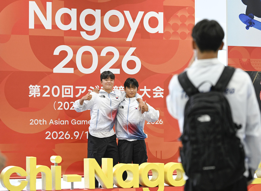 Athletes from South Korea take photos on their arrival at Chubu international airport in Tokoname, Aichi prefecture, Japan on Sept. 6, 2026, ahead of Asian Games. (Kasumi Fukudome/Kyodo News via AP)
