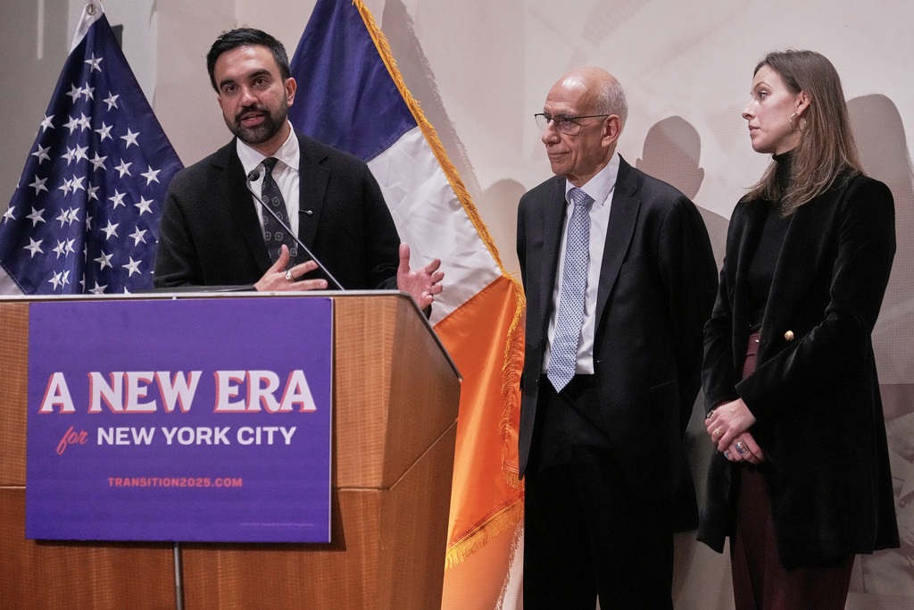 CORRECTS NAME SPELLING: New York Mayor-elect Zohran Mamdani, left, announces the appointment of Dean Fuleihan, center, as first deputy mayor and Elle Bisgaard-Church as chief of staff, in New York, Monday, Nov. 10, 2025. (AP Photo/Richard Drew)