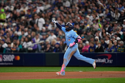Toronto Blue Jays' Vladimir Guerrero Jr. rounds the bases after hitting a solo home run against the Seattle Mariners during the fifth inning in Game 3 of baseball's American League Championship Series, Wednesday, Oct. 15, 2025, in Seattle. (AP Photo/David J. Phillip) Toronto Blue Jays' Vladimir Guerrero Jr. rounds the bases after hitting a solo home run against the Seattle Mariners during the fifth inning in Game 3 of baseball's American League Championship Series, Wednesday, Oct. 15, 2025, in Seattle. (AP Photo/David J. Phillip)