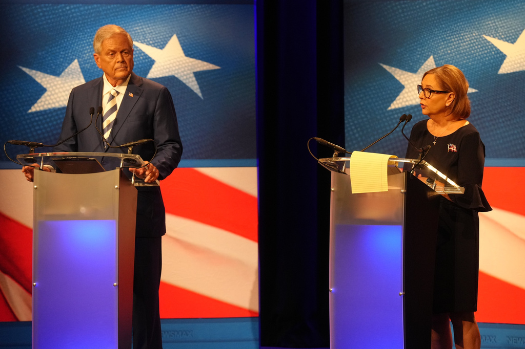 U.S. Rep. Ralph Norman, R-S.C., left, looks on as Sen. Darline Graham, R-S.C., speaks during a debate ahead of the special GOP Senate runoff election to replace the late Sen. Lindsey Graham, R-S.C., in Newberry, S.C., Tuesday, Aug. 18, 2026. (AP Photo/Meg Kinnard)