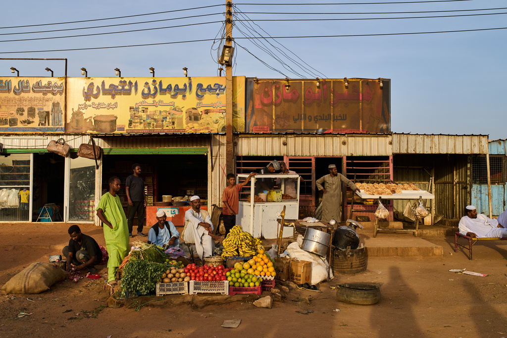 Vendors wait for customers at a local market in Sururab, near Khartoum, Sudan, Wednesday, April 22, 2026. (AP Photo/Bernat Armangue)